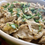 Instant Pot Salsa Verde Pulled Chicken in a baking dish
