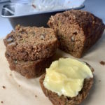 slices of garam masala spiced zucchini bread with butter