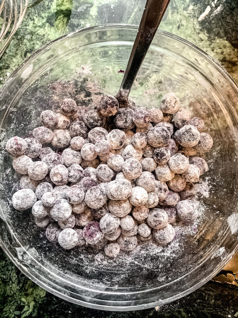 Bowl of blueberries coated in flour mixture