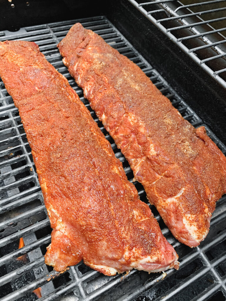 Dry rubbed bbq baby back ribs on the grill