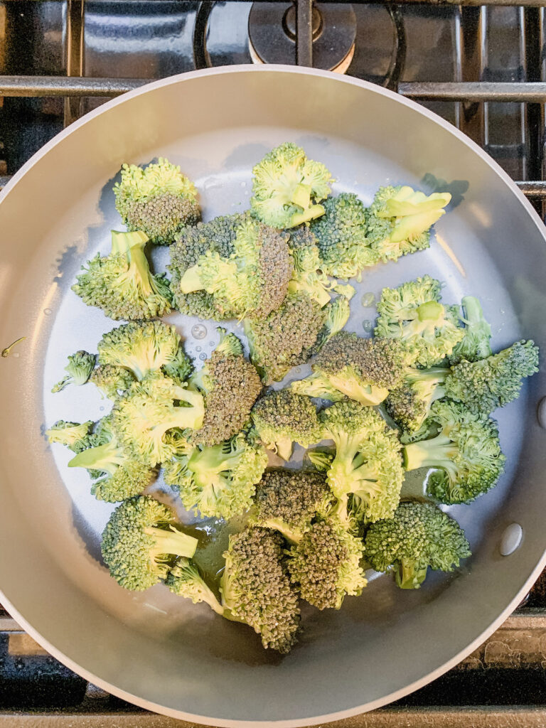 Broccoli florets in a saute pan