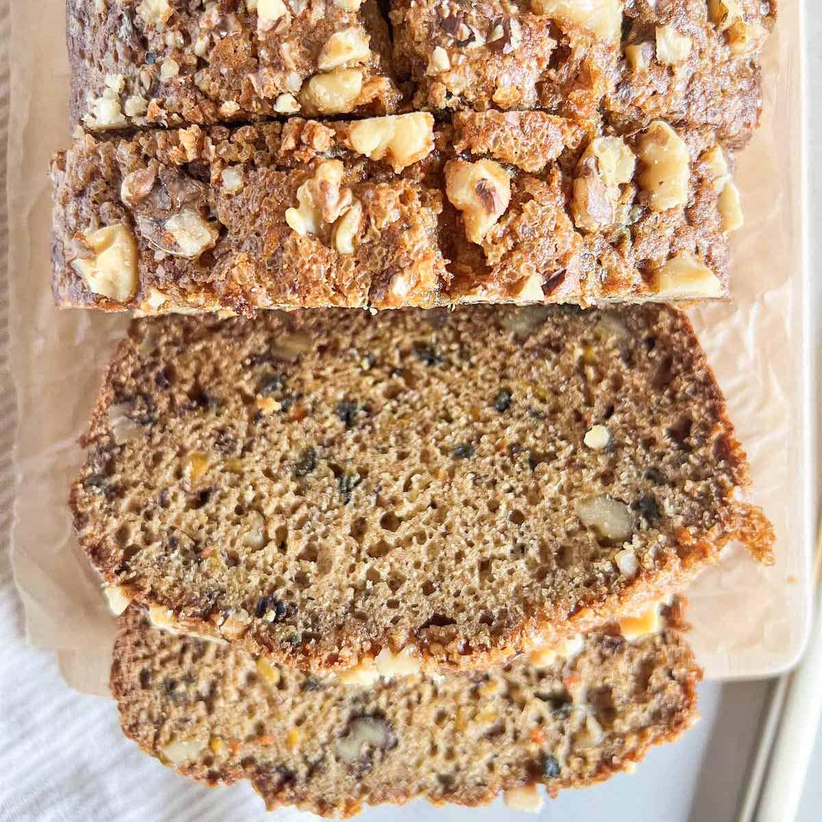 Overhead view of carrot banana bread loaf with slices cut.