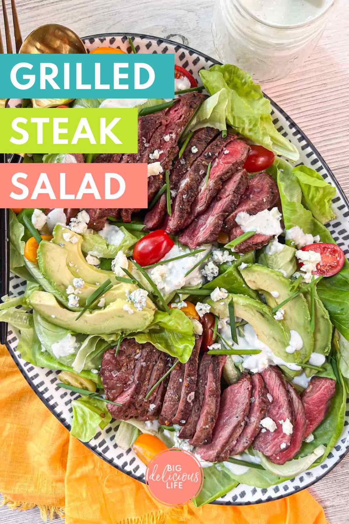 Branded Pinterest template with photo of steak salad on an oval platter with a yellow napkin.
